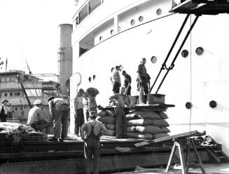 Linley Walker Wheat Co. loading wheat on a Japanese ship