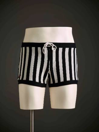 Man's black and white striped swimming trunks