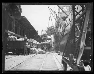 SS ULYSSES at a Sydney wharf loading wheat
