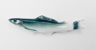 Chopsticks holder in the shape of a fish decorated with green paint