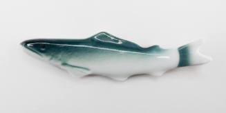 Chopsticks holder in the shape of a fish decorated with green paint