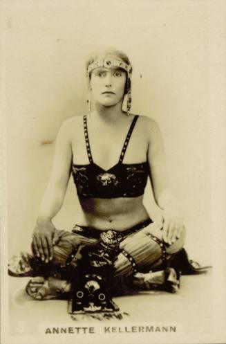 Cigarette card with photograph of Annette Kellerman in costume from the film A Daughter of the Gods (1916)
