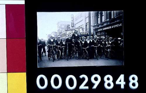 Group photograph, naval seamen on bicycles