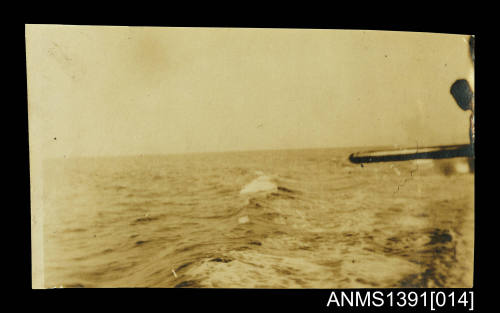 Ship's gun pointing out to sea