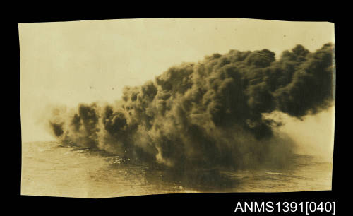 Photograph depicting an explosion at sea