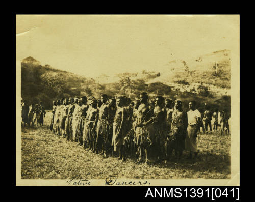 Photograph depicting a group of men in traditional costumes