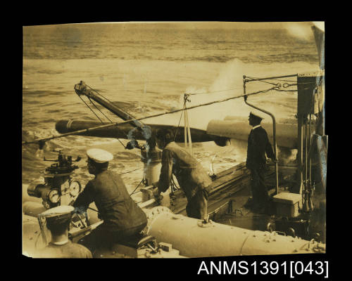 Photograph depicting a torpedo being launched from a ship