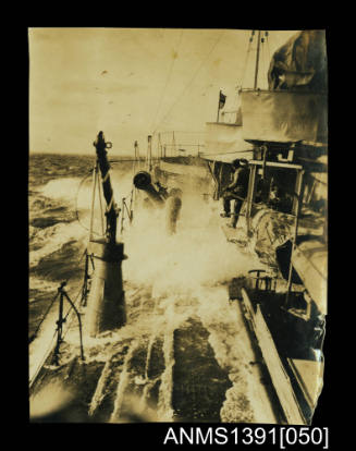 Photograph depicting a starboard view of a ship on rough seas