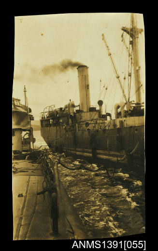 Photograph depicting a ship being re-fuelled at sea