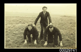 Three young men in suits, Latvia