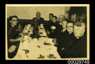 A group of men and women drinking coffee in Latvia