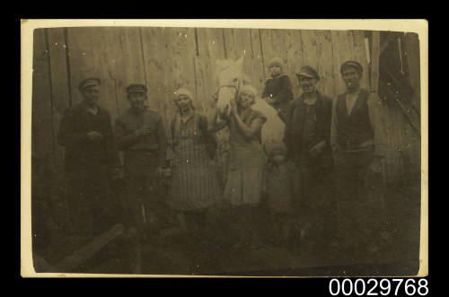Jekabs Osis, his wife and others, on their farm in Latvia