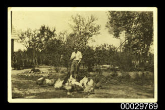 Jekabs Osis with chickens on his Latvian farm