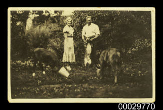 Jekabs Osis and his wife with their farm animals