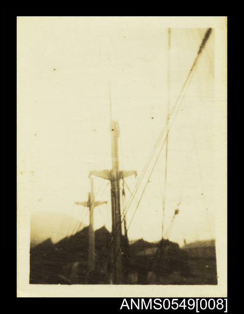 Photograph depicting the masts of a vessel