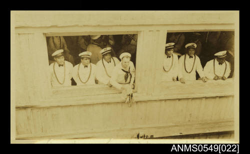 Photograph depicting a group of men in uniform on board a ship