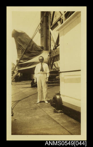 Photograph depicting a man in white suit