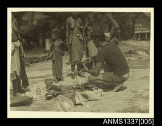 Photograph of locals trading shells for kerosene