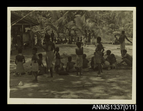 Photograph of locals waiting for trading to begin