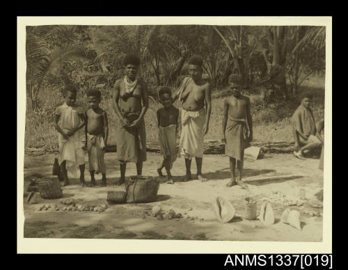 Photograph of locals trading shells