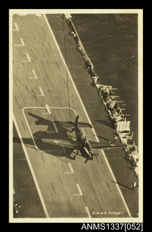 Postcard of a Grumman Avenger aircraft catching the arrestor wire on landing onboard HMAS SYDNEY III
