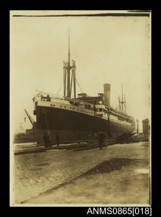 Vessel moored alongside wharf