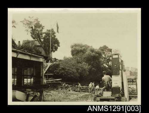 Photograph of men filling in the bay for a parade ground at SEAHORSE Depot