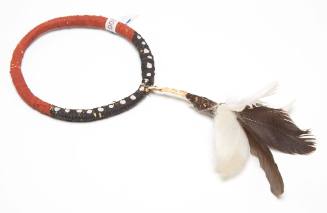 Pukumani armband with feather tuft