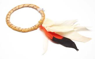 Woven pandanus armband with feather tuft
