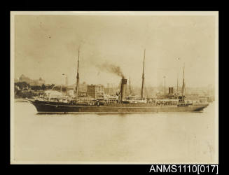 Photograph of an auxiliary steam ship in a harbour