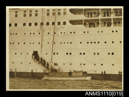 Photograph of an official party boarding a passenger ship