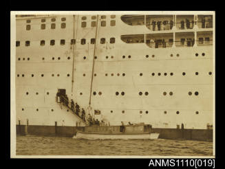 Photograph of an official party boarding a passenger ship