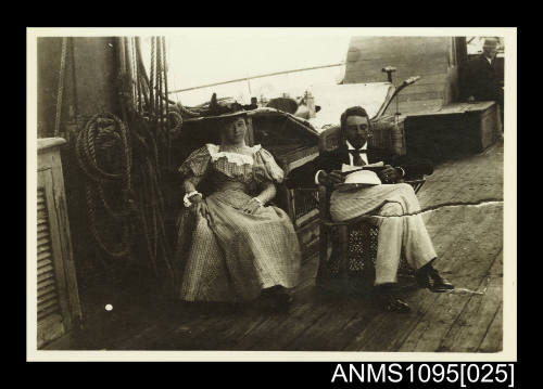 Photograph of a seated man and woman on board the MACQUARIE