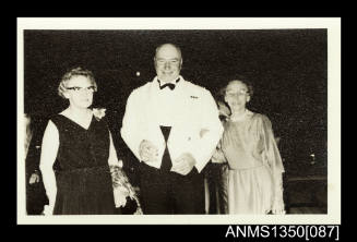 Captain Dun and two unidentified women