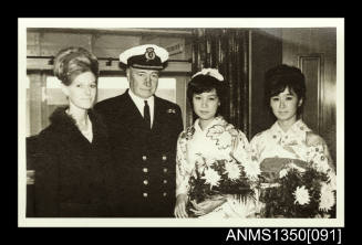 Captain Dun and three unidentified women