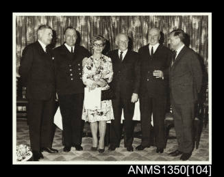 Captain Dun and a group of people at a retirement party.