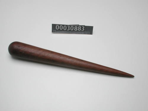 CONE SHAPED FID WITH TRACES OF RED PAINT ON ITS ROUNDED END