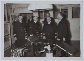Royal Australian Navy officers and Prime Minister Menzies on board TSS ORANJE II