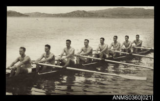 Oarsmen of the NSW crew in their shell