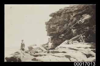 Swimmers on a rock platform