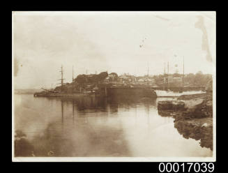 Sailing ships at anchor in a bay