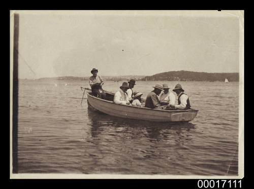 Crowded dinghy on Sydney Harbour