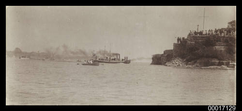 Group of spectators looking at the harbour