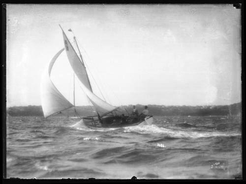 Gaff-rigged yacht  A 31 from SASC sailing on harbour with a shy spinnaker