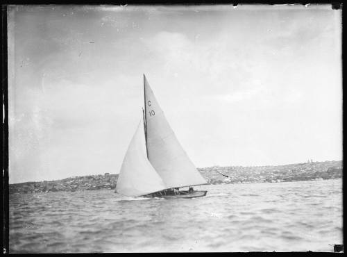 Classic gaff rigged yacht with sail numbers of  C over 10 sails on Sydney Harbour.