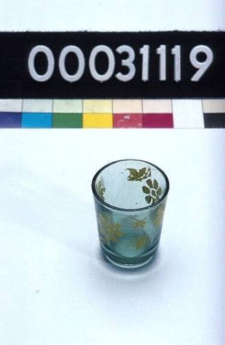 Drinking glass with yellow flowers, similar to those used on TU DO