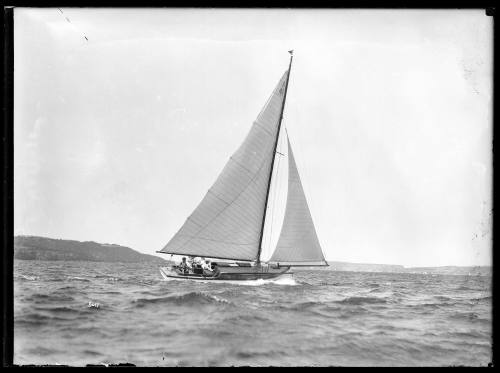 SASC yacht with cabin sail number 4  heads across Sydney Harbour