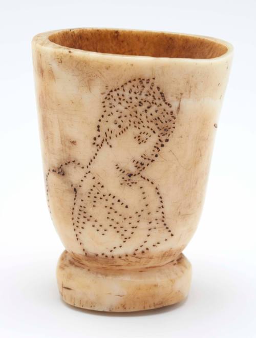 Scrimshaw dice shaker cup with image of woman