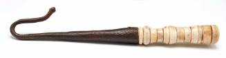 Scrimshaw crook fitted with handle from whale tooth
