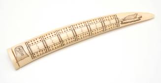 Cribbage board carved from walrus tusk
